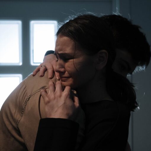 crying woman being hugged