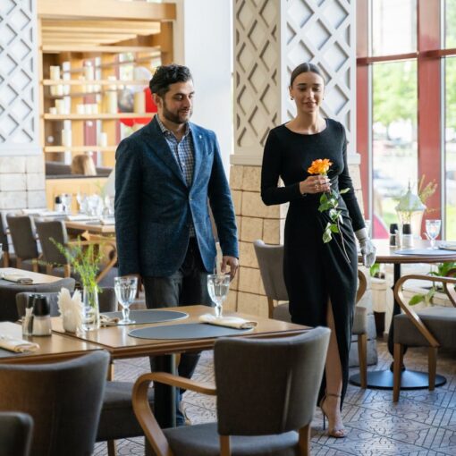 man-and-woman-walking-at-the-restaurant