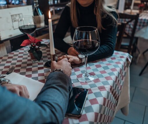 woman-wearing-black-sweater-holding-hand-with-man-wearing-gray-suit-jacket