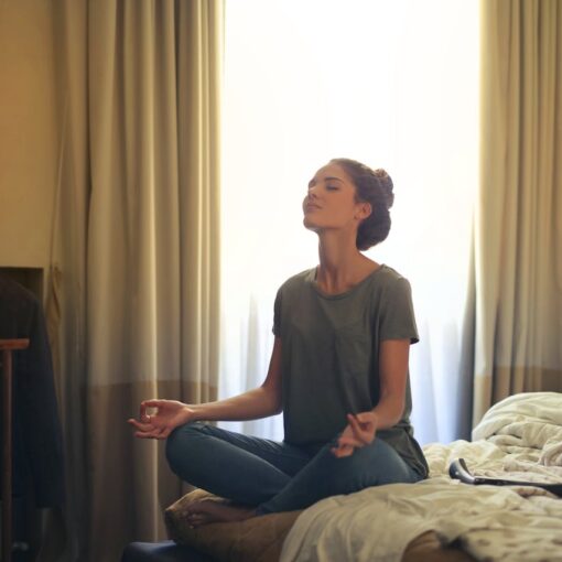 woman-meditating-in-bedroom
