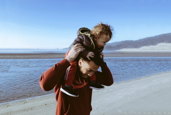 father-carrying-his-child-on-his-shoulders